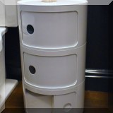 F38. Modern round bath cabinet with sliding doors. 
